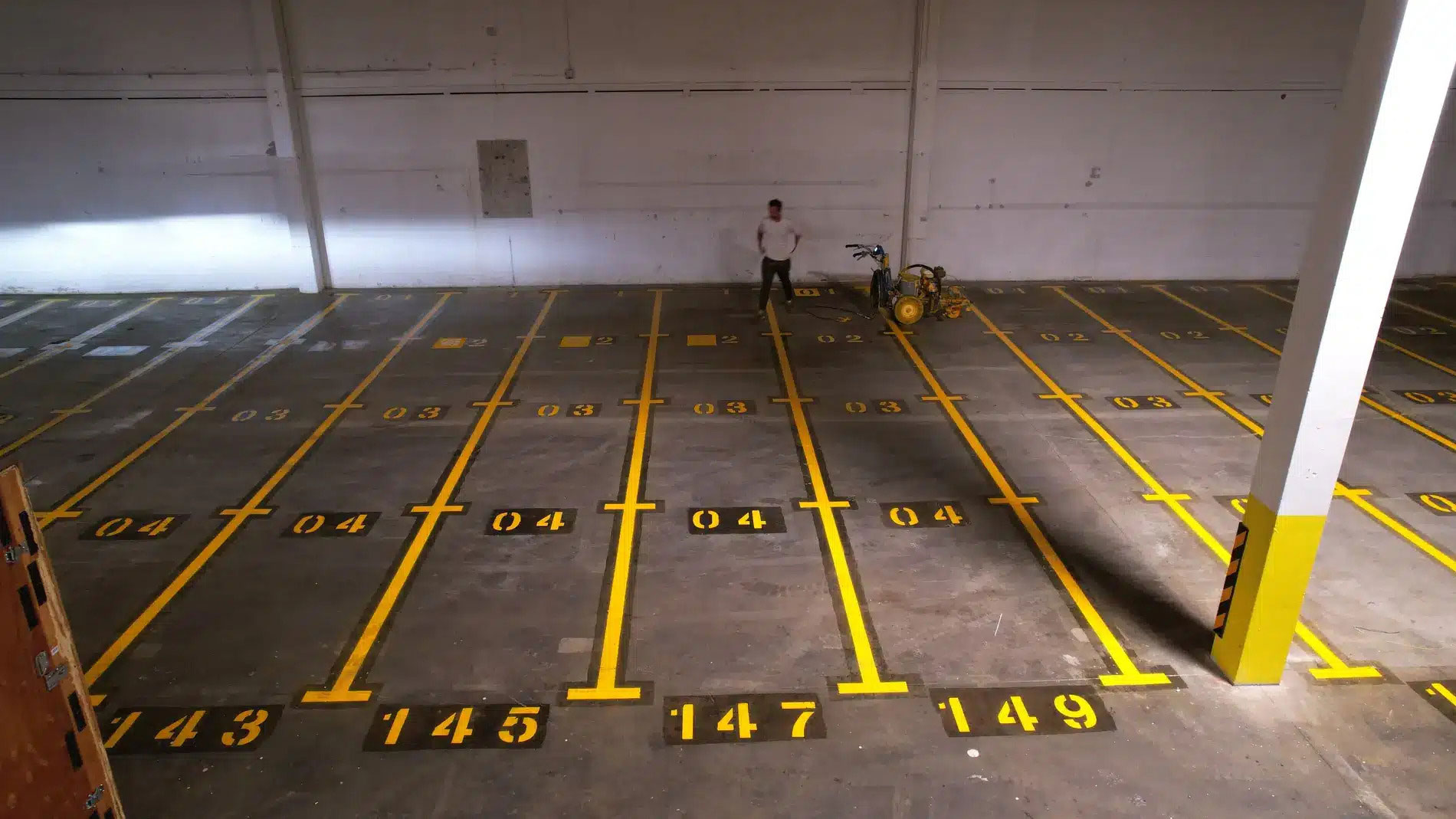 Underground Asphalt Parking Lot with numbered line painting