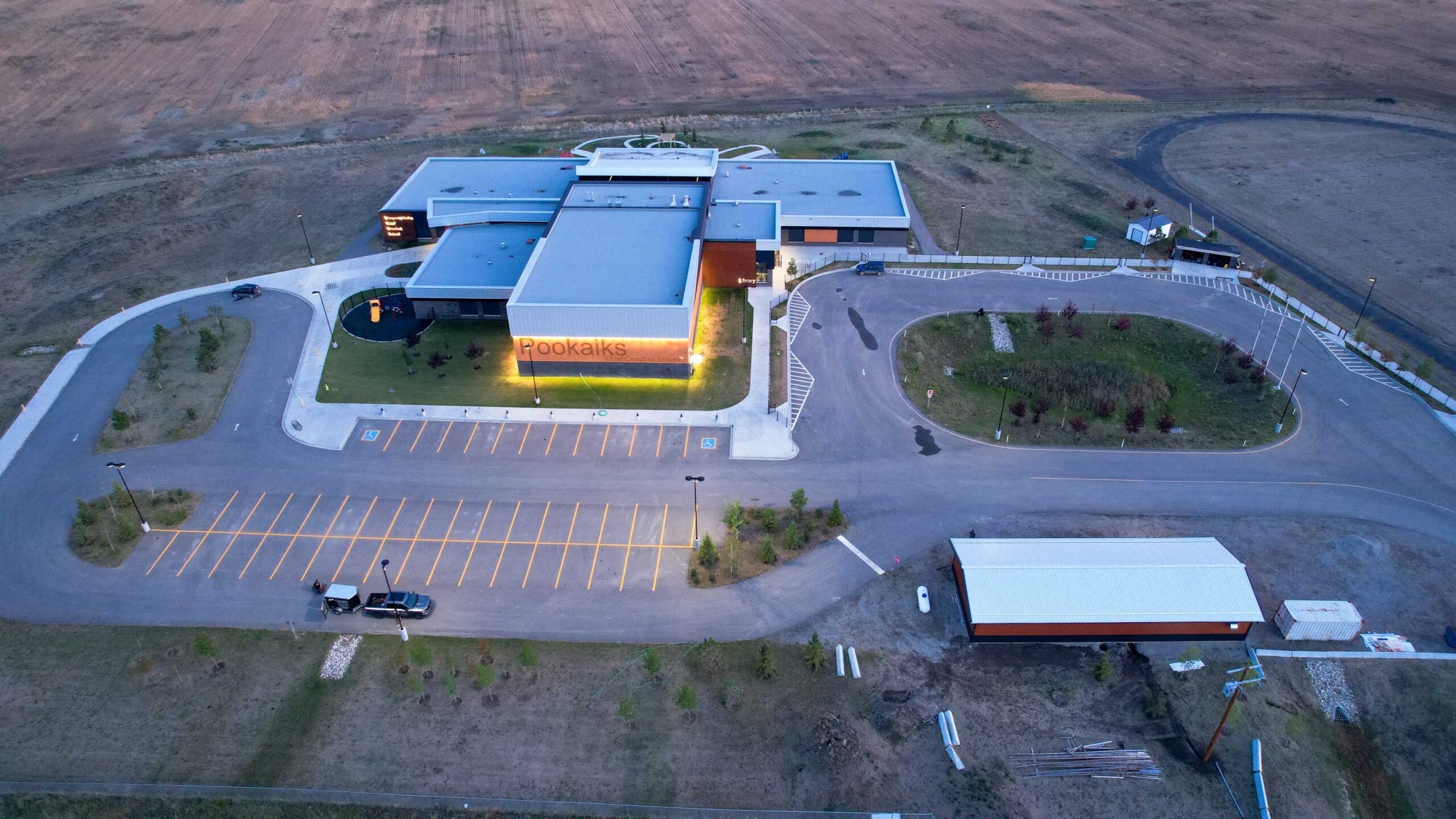 Pookaiks building and asphalt parking lot